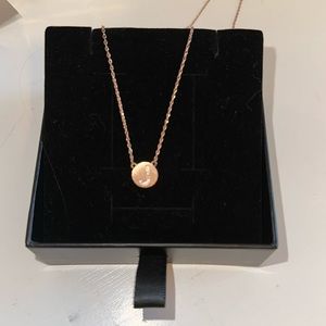 rose gold initial “J” necklace.